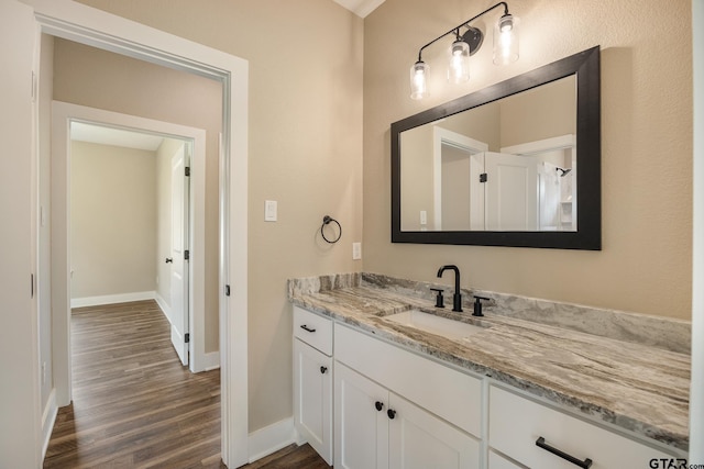 14524 Woodland Creek Dr, Tyler, TX 75706 - bathroom featuring wood finished floors, vanity, and baseboards