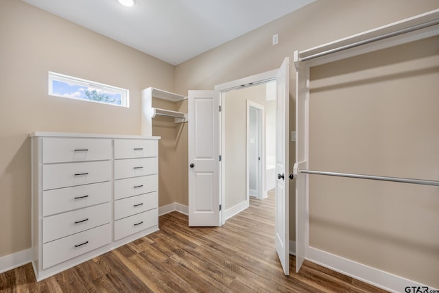 14524 Woodland Creek Dr, Tyler, TX 75706 - walk in closet featuring dark wood-style flooring