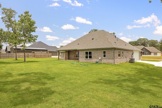 14524 Woodland Creek Dr, Tyler, TX 75706 - back of house featuring a garage, brick siding, a shingled roof, and driveway
