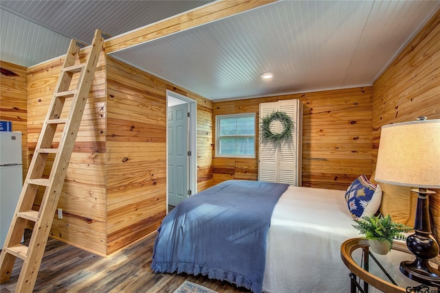 313 County Road 1442, Sulphur Springs, TX 75482 - bedroom featuring wood walls and wood finished floors
