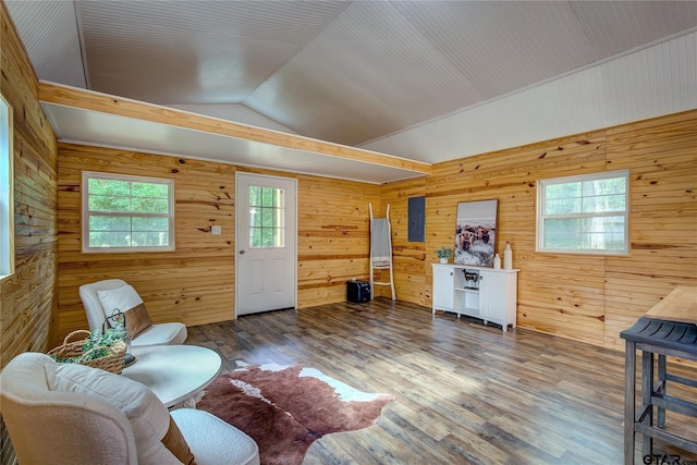 313 County Road 1442, Sulphur Springs, TX 75482 - living room with lofted ceiling, wooden walls, wood finished floors, and electric panel