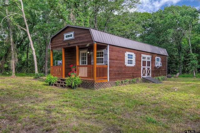313 County Road 1442, Sulphur Springs, TX 75482 - view of outbuilding with covered porch, cooling unit, and a wooded view