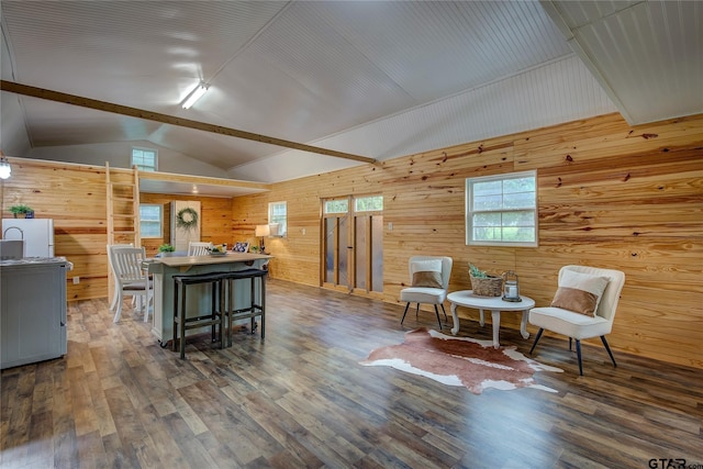 313 County Road 1442, Sulphur Springs, TX 75482 - living room featuring wood walls, vaulted ceiling, and wood finished floors