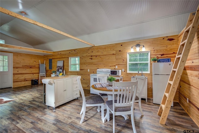 313 County Road 1442, Sulphur Springs, TX 75482 - dining room with wooden walls, wood finished floors, and lofted ceiling