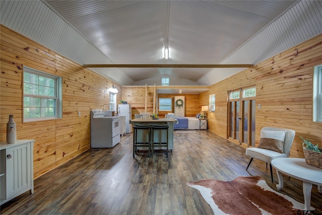 313 County Road 1442, Sulphur Springs, TX 75482 - kitchen featuring electric range, wood walls, open floor plan, vaulted ceiling, and dark wood-style flooring