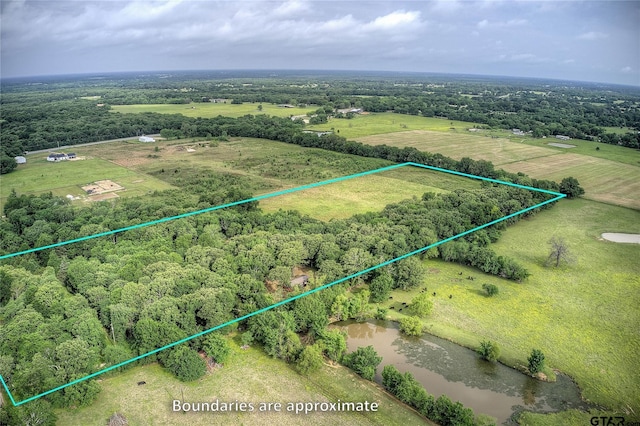 313 County Road 1442, Sulphur Springs, TX 75482 - view of rural area with property boundaries highlighted and a nearby body of water