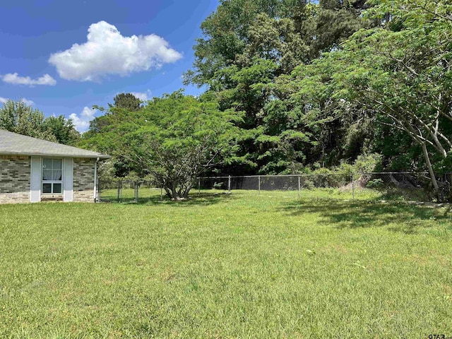 view of yard with fence