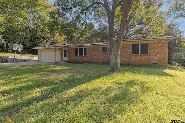 single story home featuring a front lawn and a garage