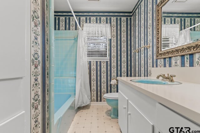 full bathroom featuring toilet, vanity, and shower / bath combo