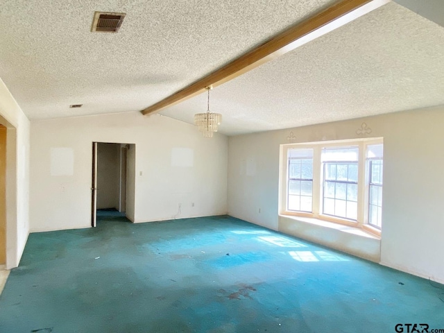 carpeted spare room with vaulted ceiling with beams, a textured ceiling, visible vents, and a notable chandelier