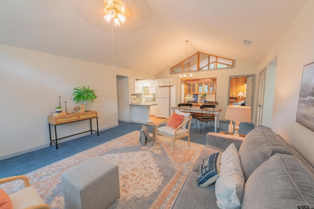 carpeted living room featuring high vaulted ceiling and ceiling fan with notable chandelier