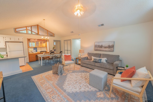 carpeted living room with a textured ceiling, vaulted ceiling, and ceiling fan with notable chandelier