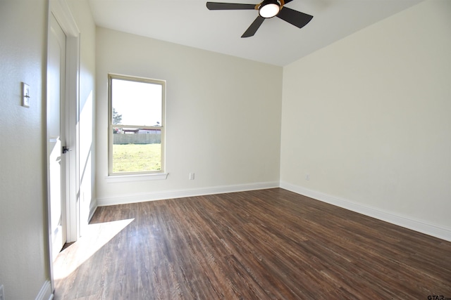 spare room featuring dark hardwood / wood-style floors and ceiling fan