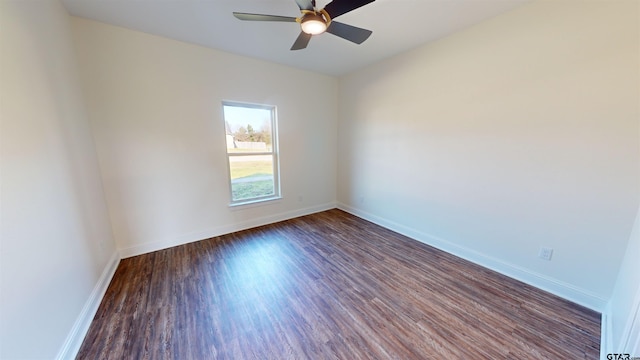 empty room featuring dark hardwood / wood-style floors and ceiling fan