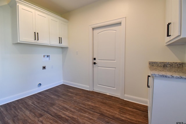 clothes washing area featuring electric dryer hookup, cabinets, washer hookup, and dark hardwood / wood-style floors