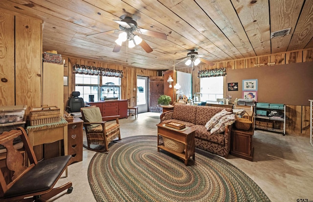 living room with wood walls, ceiling fan, and wood ceiling