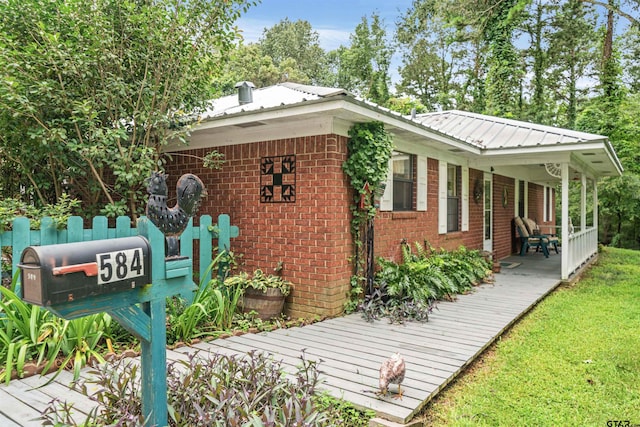 view of side of home featuring a yard