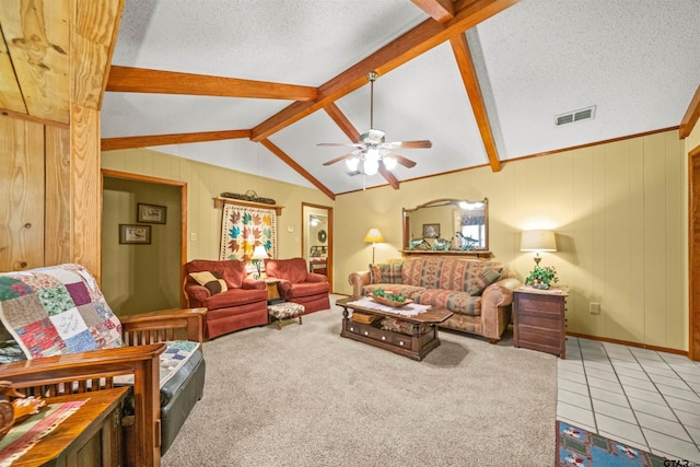 carpeted living room featuring a textured ceiling, lofted ceiling with beams, wooden walls, and ceiling fan