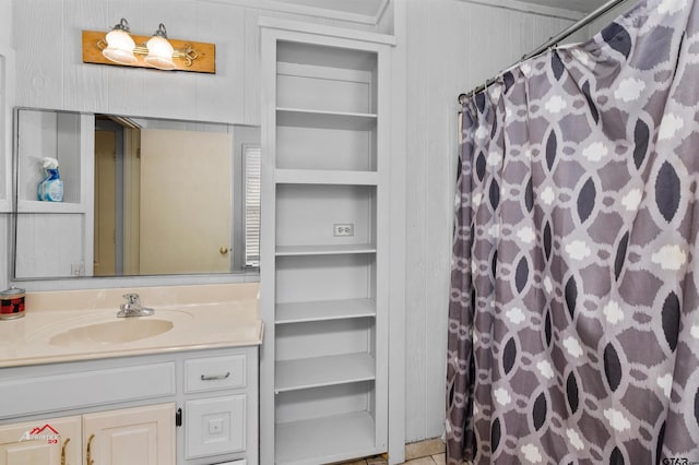 bathroom featuring vanity and a shower with shower curtain