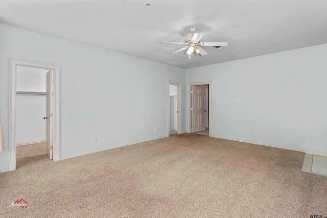 interior space featuring carpet floors and ceiling fan