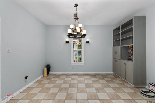 unfurnished dining area featuring a notable chandelier