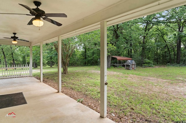 view of patio / terrace with a shed and ceiling fan