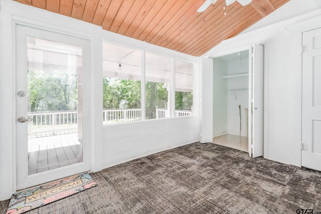 unfurnished sunroom featuring ceiling fan, wooden ceiling, and vaulted ceiling