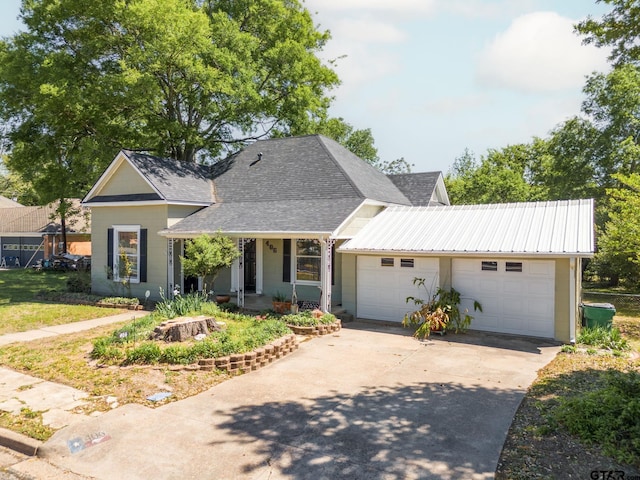 view of front of property featuring a garage and a porch