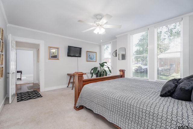 bedroom featuring ceiling fan, light colored carpet, and crown molding