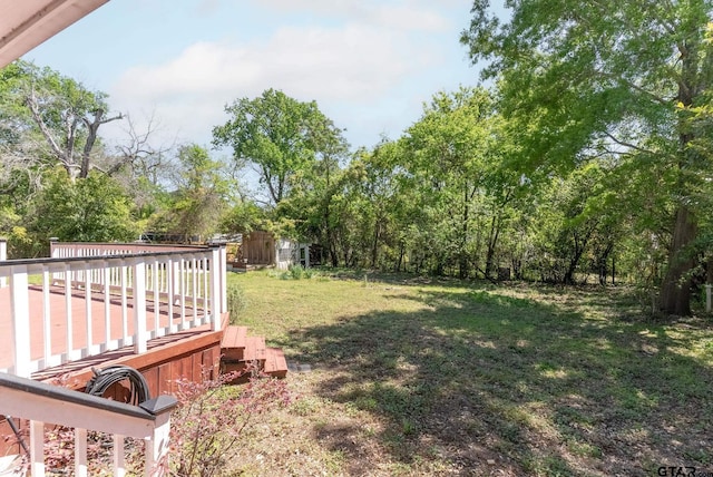 view of yard with a deck