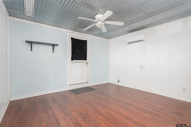 unfurnished room featuring hardwood / wood-style flooring, ceiling fan, and a wall mounted AC