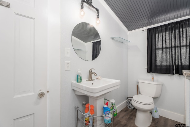 bathroom with hardwood / wood-style flooring, sink, toilet, and crown molding