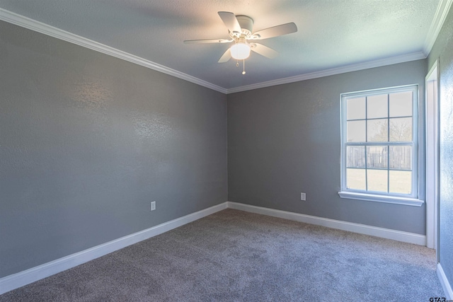 carpeted empty room featuring ceiling fan, a textured ceiling, and ornamental molding