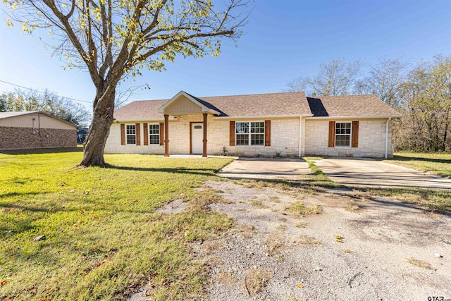 ranch-style house with a front yard