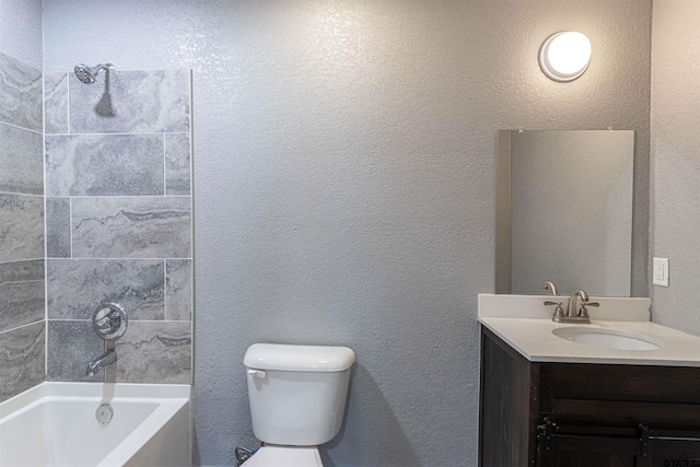 full bathroom featuring vanity, toilet, and tiled shower / bath