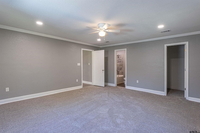 spare room with crown molding, carpet floors, a textured ceiling, and ceiling fan