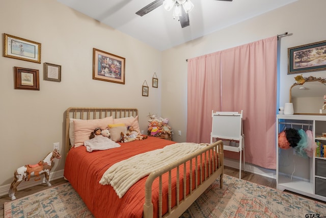 bedroom with hardwood / wood-style flooring and ceiling fan