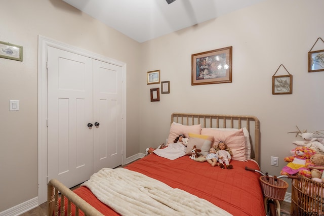 bedroom featuring hardwood / wood-style flooring and a closet