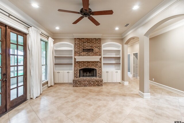 12260 Jazmin Cir, Flint, TX 75762 - entryway featuring arched walkways, ornamental molding, light tile patterned floors, healthy amount of natural light, and a chandelier