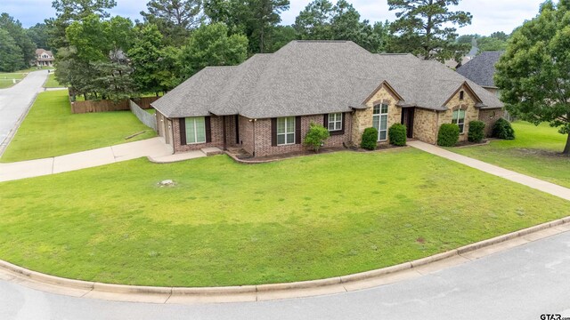 12260 Jazmin Cir, Flint, TX 75762 - empty room with healthy amount of natural light, a ceiling fan, light carpet, lofted ceiling, and baseboards