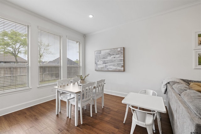 dining space featuring baseboards, ornamental molding, dark wood finished floors, and recessed lighting