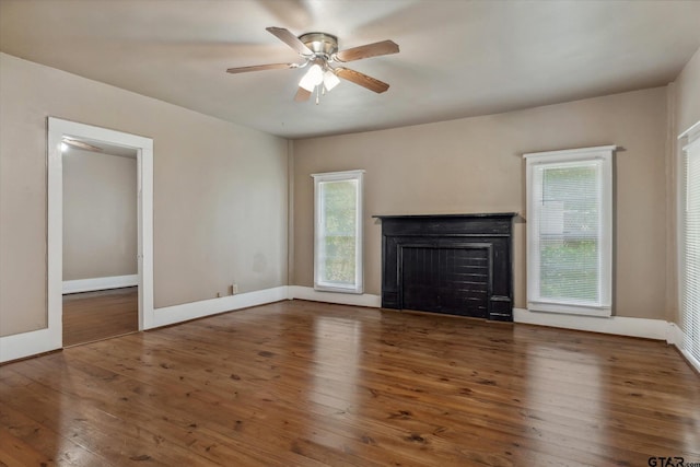 1498 Fm 279, Ben Wheeler, TX 75754 - unfurnished living room featuring a fireplace, a ceiling fan, and hardwood / wood-style floors