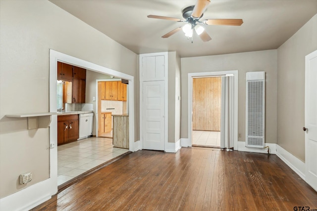 1498 Fm 279, Ben Wheeler, TX 75754 - unfurnished living room with a heating unit, ceiling fan, and wood-type flooring