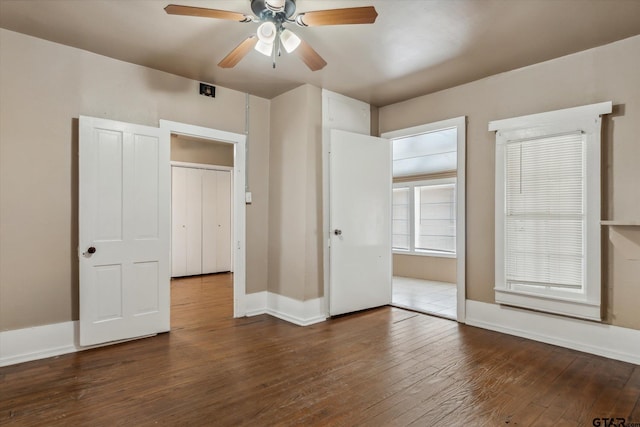 1498 Fm 279, Ben Wheeler, TX 75754 - unfurnished bedroom featuring dark wood finished floors and ceiling fan