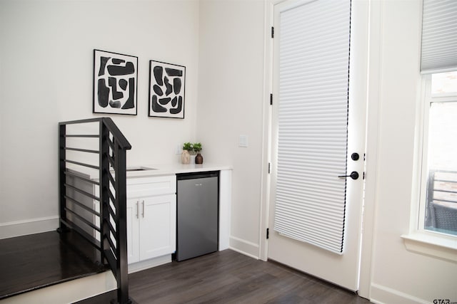 doorway to outside with dark hardwood / wood-style floors