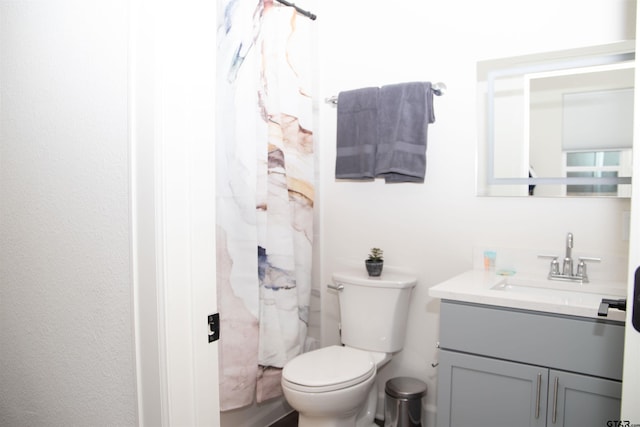 bathroom featuring toilet and vanity