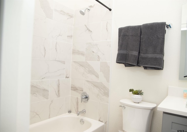 full bathroom with vanity, toilet, and tiled shower / bath combo