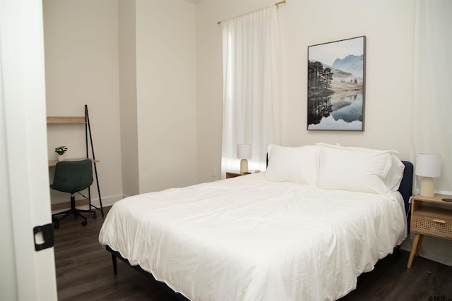 bedroom featuring dark hardwood / wood-style flooring