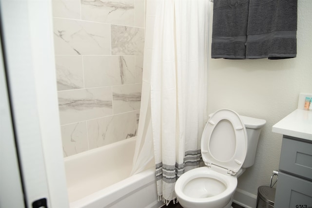 full bathroom with toilet, vanity, and shower / bath combo with shower curtain