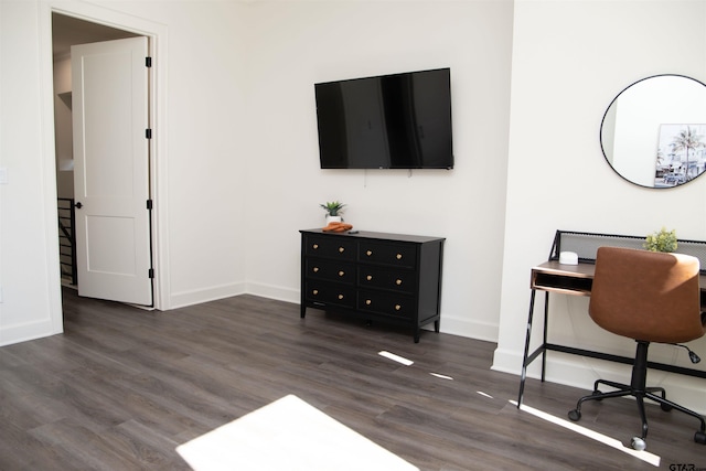 office with dark wood-type flooring